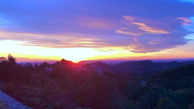 Sunset Over Landscape with Cloudscape in Les Baux De Provence, France.