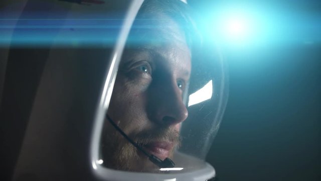 the face of the astronaut in the helmet close-up