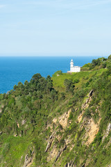 Fototapeta na wymiar The lighthouse of Monte Igeldo in San Sebastian, Donostia, Basque Country of Spain. Vertical framing. 