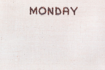 The word Monday written with coffee beans , aligned at the top.