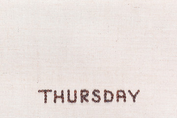 The word Thursday written with coffee beans , aligned at the bottom.