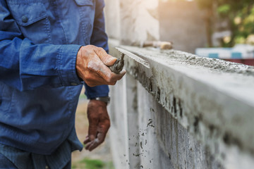 closeup hand of worker are plastering