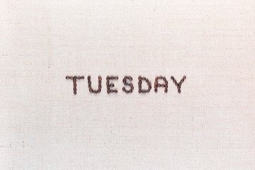 The word Thursday written with coffee beans , aligned in the center.