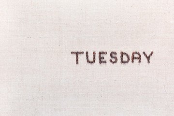 The word Thursday written with coffee beans , aligned to the right.