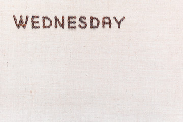 The word Wednesday written with coffee beans , aligned at the top left.