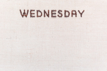 The word Wednesday written with coffee beans , aligned at the top.