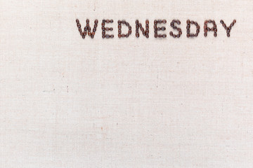 The word Wednesday written with coffee beans , aligned at the top right.