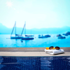Fototapeta na wymiar Summer background of swimming pool and free space for your decoration 