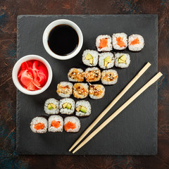 Japanese sushi on a rustic dark background.