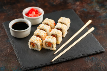 Japanese sushi on a rustic dark background.