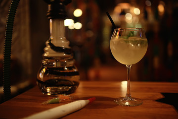 cocktail in a modern restaurant / glass with a bright cocktail in the fashionable interior serving in the restaurant, nightclub