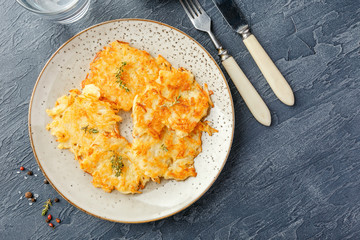 Pan-fried potato pancakes - rosti, kartoffelpuffer, latkes, draniki, hash browns