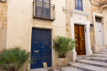 Fototapeta na wymiar Typical old wooden doors in the streets of Valletta, Malta