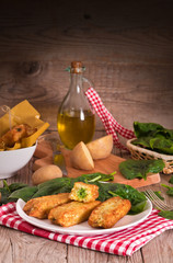Potato croquettes with spinach and mozzarella.