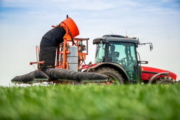 Farmer spraying wheat crops