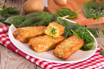 Potato croquettes with spinach and mozzarella.