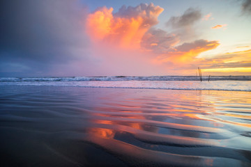 seascape with reflection clouds, Patterns Texture of sand on the beach. Beautiful sunset clouds at Thailand