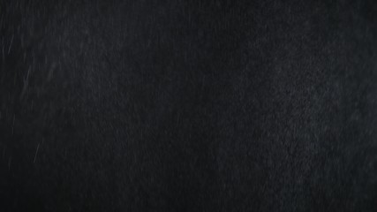 Rain on black background