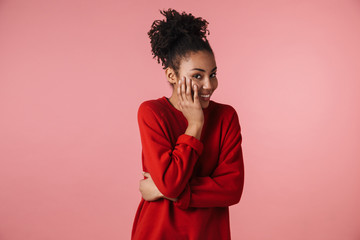 Amazing young happy excited african woman posing isolated over pink wall background covering face.