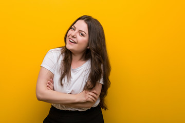 Obraz premium Young curvy plus size woman laughing and having fun.