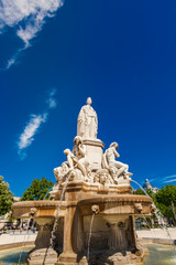 Fototapeta na wymiar Pradier fountain at Esplanade Charles-de-Gaulle in Nimes, France