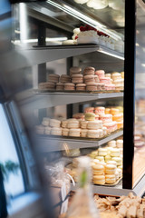 Colorful Macaroons. tasty French macaroon in the shop window. Dessert at pastry confectionary shop. Summer sweets
