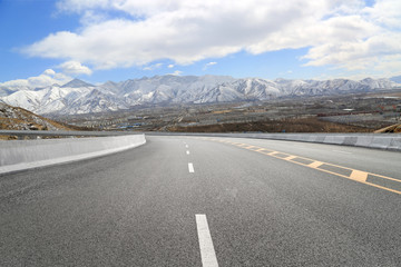Empty highways and distant mountains