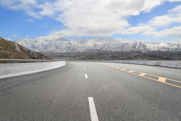 Empty highways and distant mountains