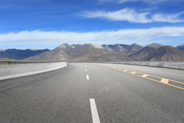 Empty highways and distant mountains