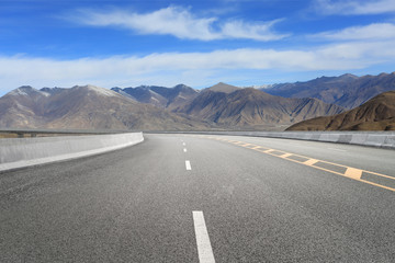 Empty highways and distant mountains