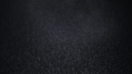 White exploding powder over black background