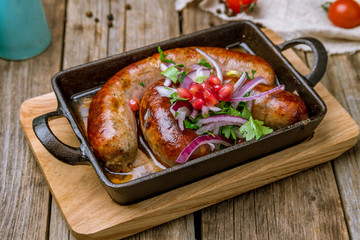 beef kupaty on board on wooden background