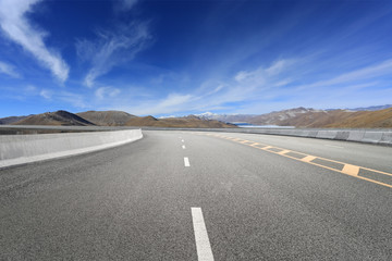 Empty highways and distant mountains