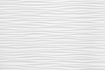 Beautiful and voluminous white wall surface in the form of waves. Gypsum panels for finishing walls in the form of waves