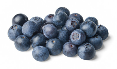 A small pile of fresh juicy blueberries isolated on white. Side view.