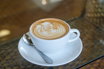 cup of coffee on wooden table