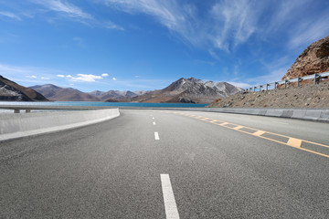 Empty highways and distant mountains
