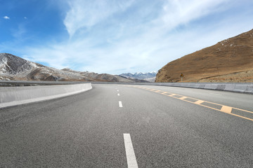 Empty highways and distant mountains