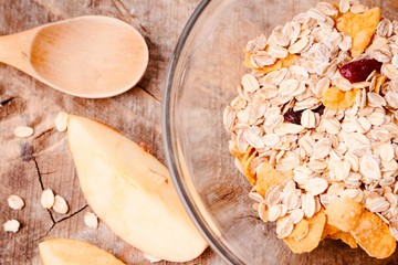 Healthy breakfast, oatmeal bowl on wooden background 