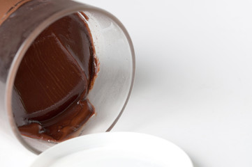 Tasty chocolate spread in jar isolated on white background