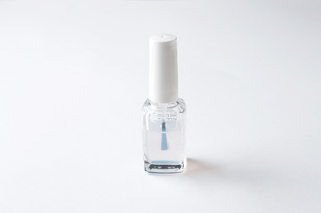 Bottle of nail polish isolated on white background, copy space