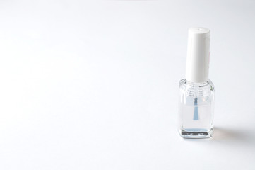 Bottle of nail polish isolated on white background, copy space