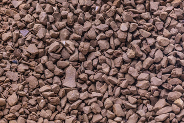 Granules of instant coffee background texture close-up with instant coffee