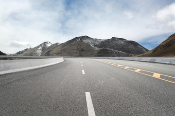 Empty highways and distant mountains