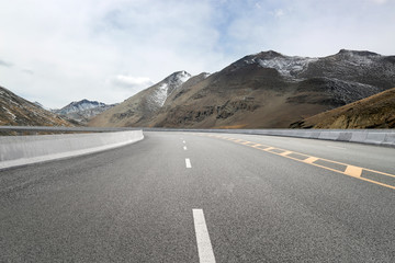 Empty highways and distant mountains