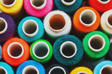 Colorful spools of sewing thread. Colored thread for sewing