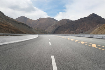 Empty highways and distant mountains