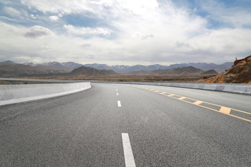 Empty highways and distant mountains