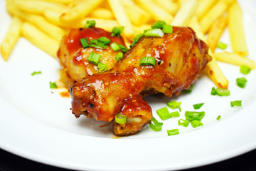 Chicken legs with french fries potatoes