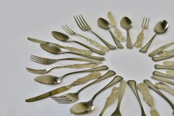 kitchen set of spoons forks and knives on a white background